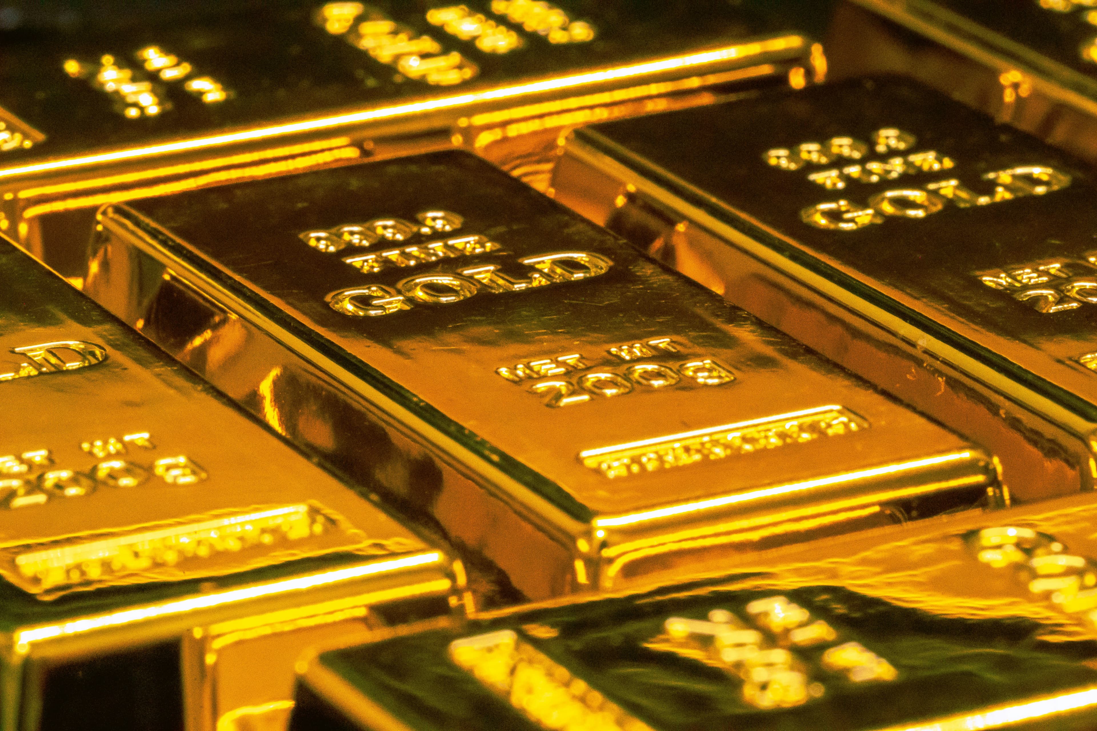 Gold bars and financial charts